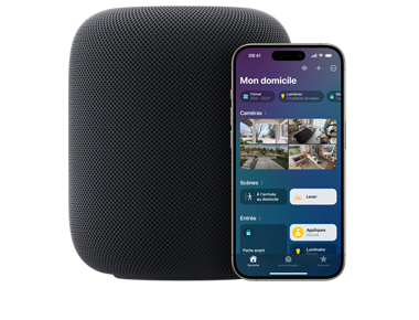 Un HomePod minuit placé à côté d’un iPhone montrant la vue Mon domicile de l’app Domicile.