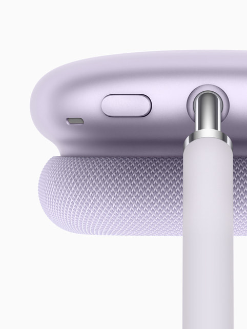 A closeup of AirPods Max in purple.