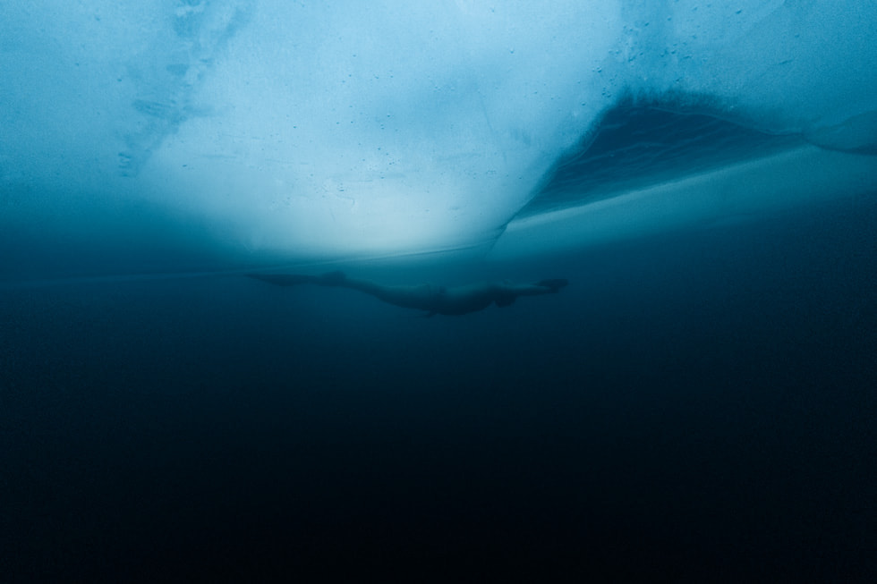 A diver is seen underwater in the “Ice Dive” episode of “Adventure.”