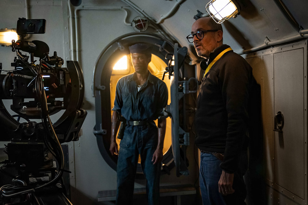 Actor Jordan Barton stands alongside director Edward Berger on the submarine set of “Submerged.”