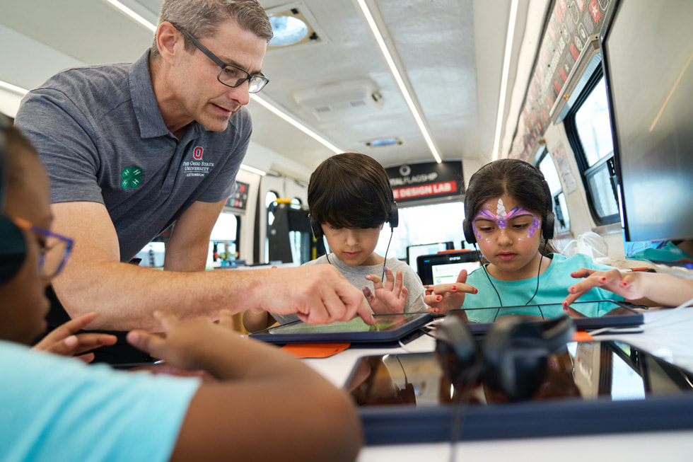 Students and instructor Mark Light on the 4-H mobile classroom bus in Ohio.