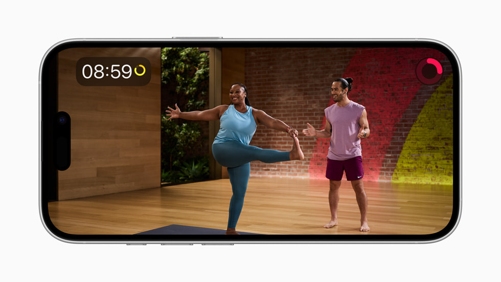 The Yoga Peak Poses program in Apple Fitness+ is shown on iPhone 16.