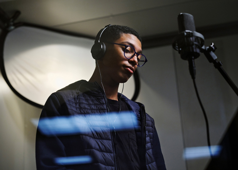 New Rochelle High School student Noah Massey records a song. 