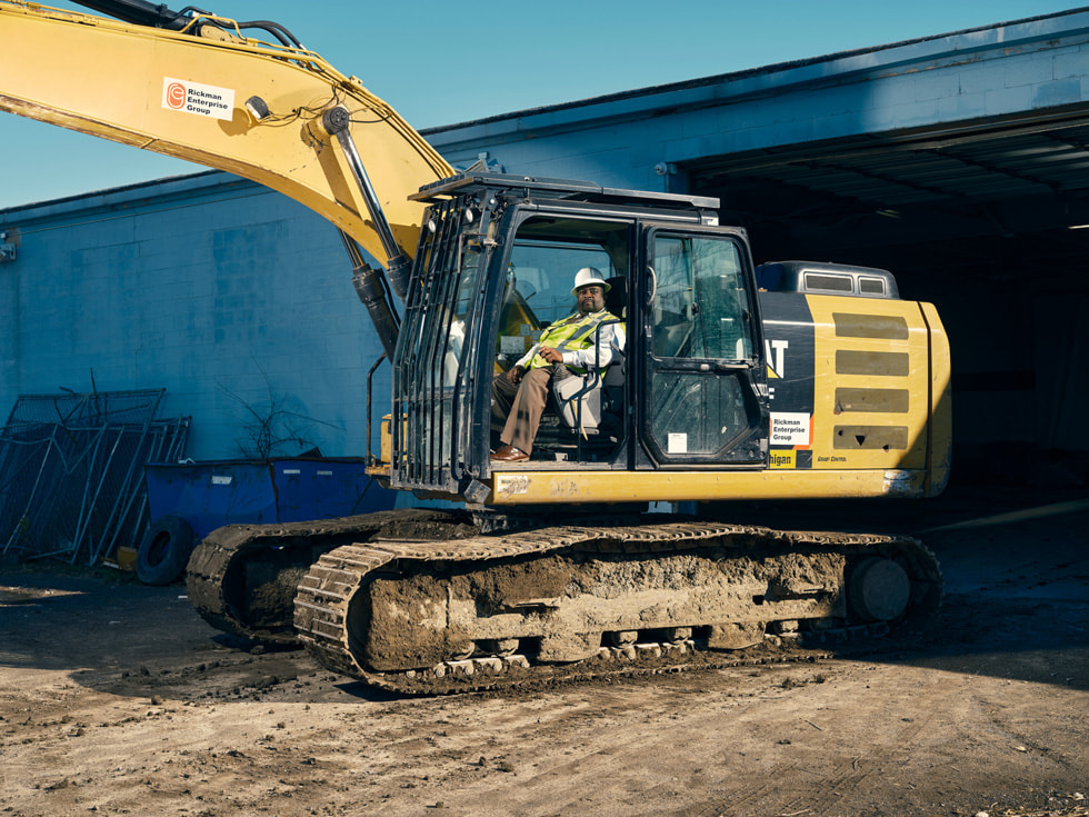 Roderick Rickman, chairman and CEO of the Rickman Enterprise Group, operating a tractor.