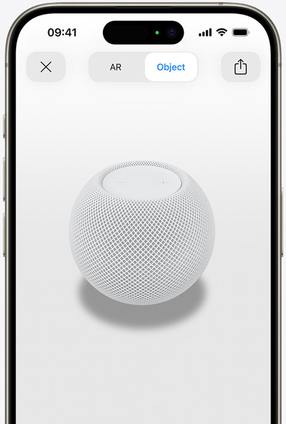 White HomePod on the screen of an iPhone in AR view.