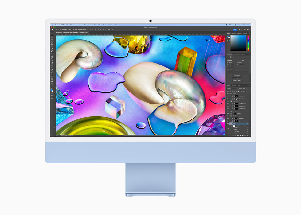 一位用户在一台蓝色 iMac 上使用 Photoshop。