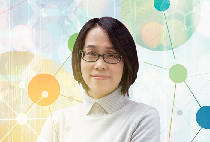 Photo-illustration of Jier Huang with multiple molecular structures around her