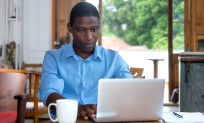 Kenyan man on computer