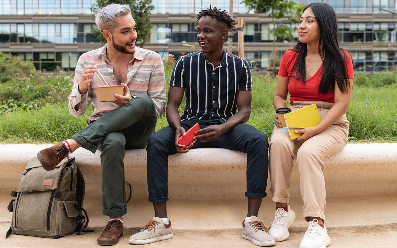 Diverse-people-having-fun-eating-takeaway-food-outdoor-in-the-city-Focus-on-queer-gay-man-face