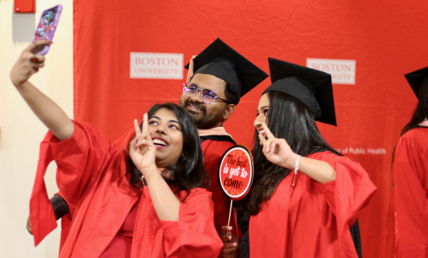 Graduates pose for a selfie at the 2024 December Graduate Reception