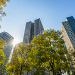 Business towers and Green leaves