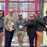 Members of the newly expanded research collaborative elTEAMnetwork stand side-by-side all wearing sunglasses