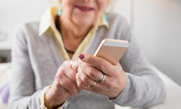 Senior woman holding smartphone