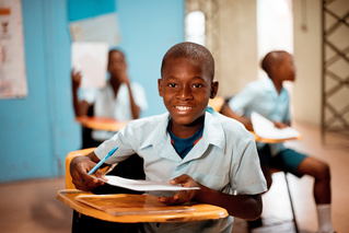 child at desk at school