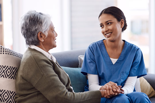 Doctor holding hands with a patient