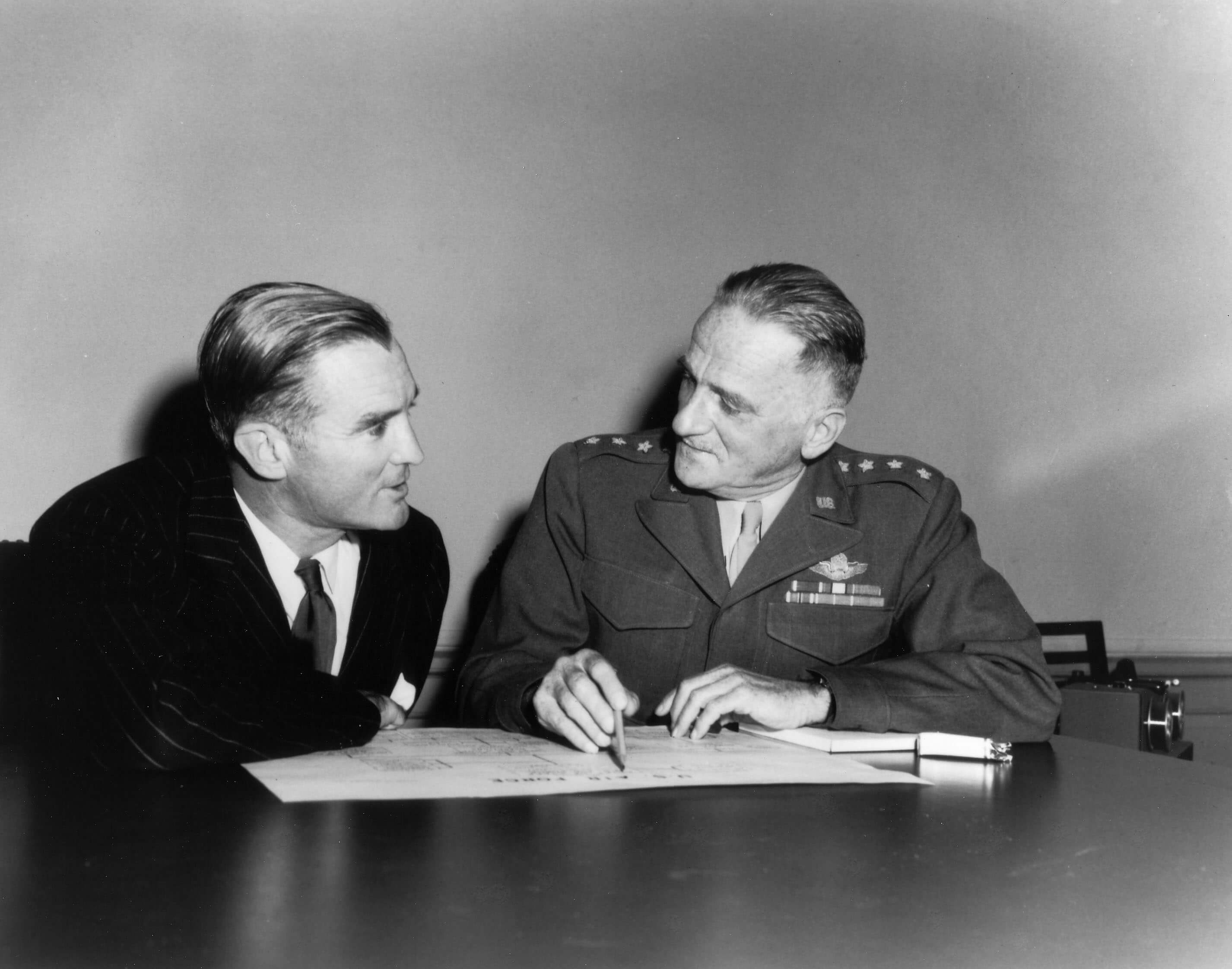 A general signing the paperwork to establish the U.S. Air Force Academy