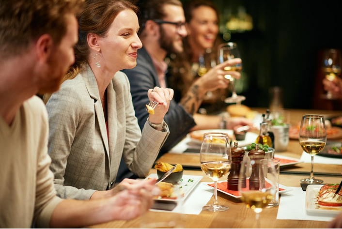 a group of people dining in a fancy restaurant