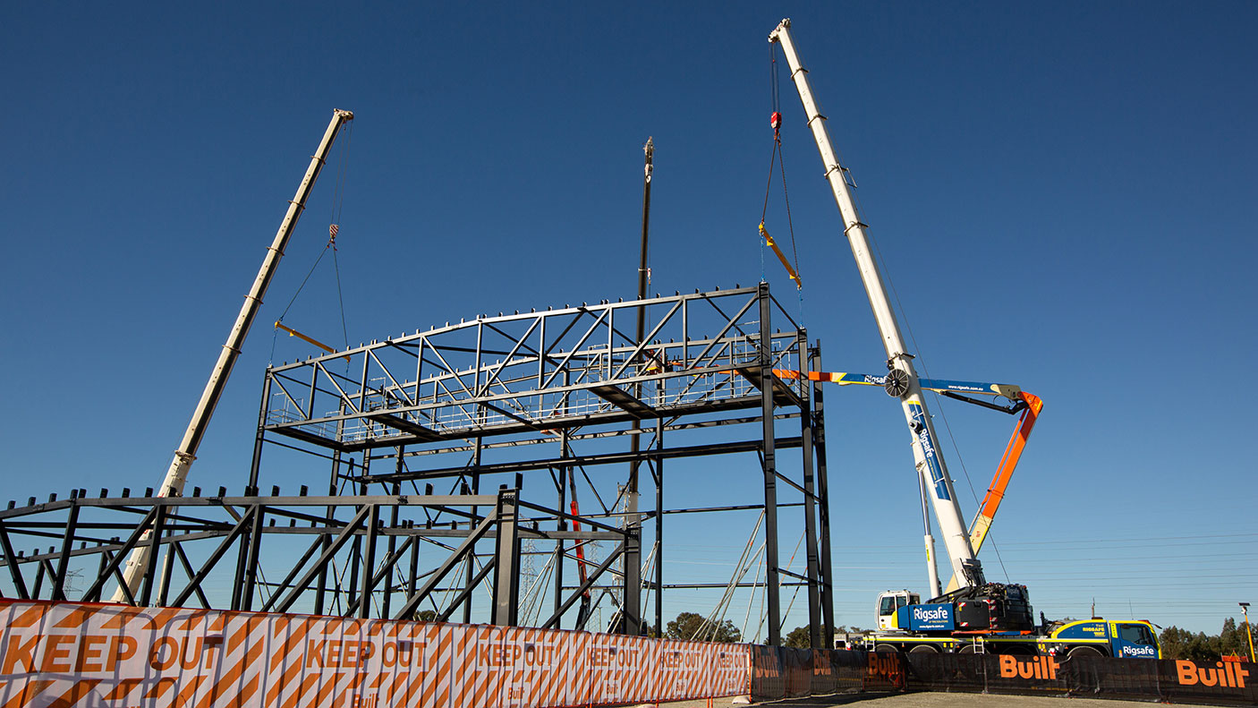 2 cranes on a construction site