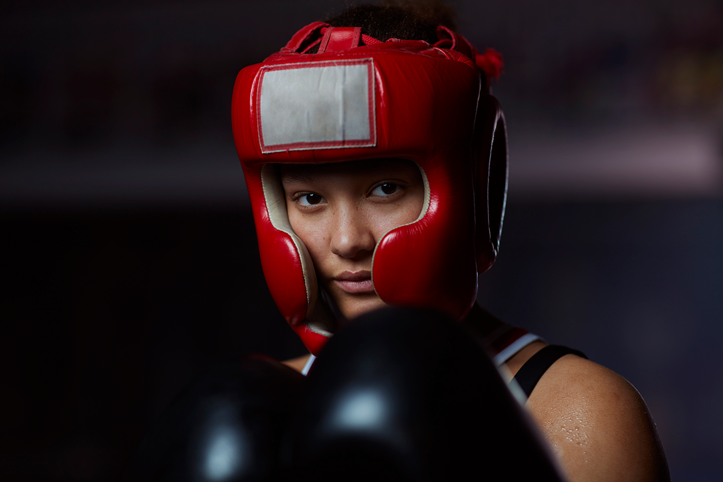 Portrait of teenage athletic boxing girl - stock photo