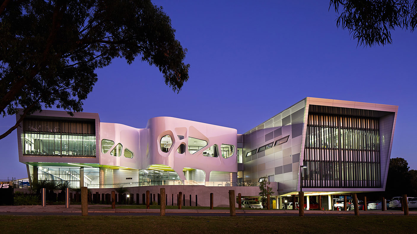 WAIS buildings lit up at dusk against a dark sky.