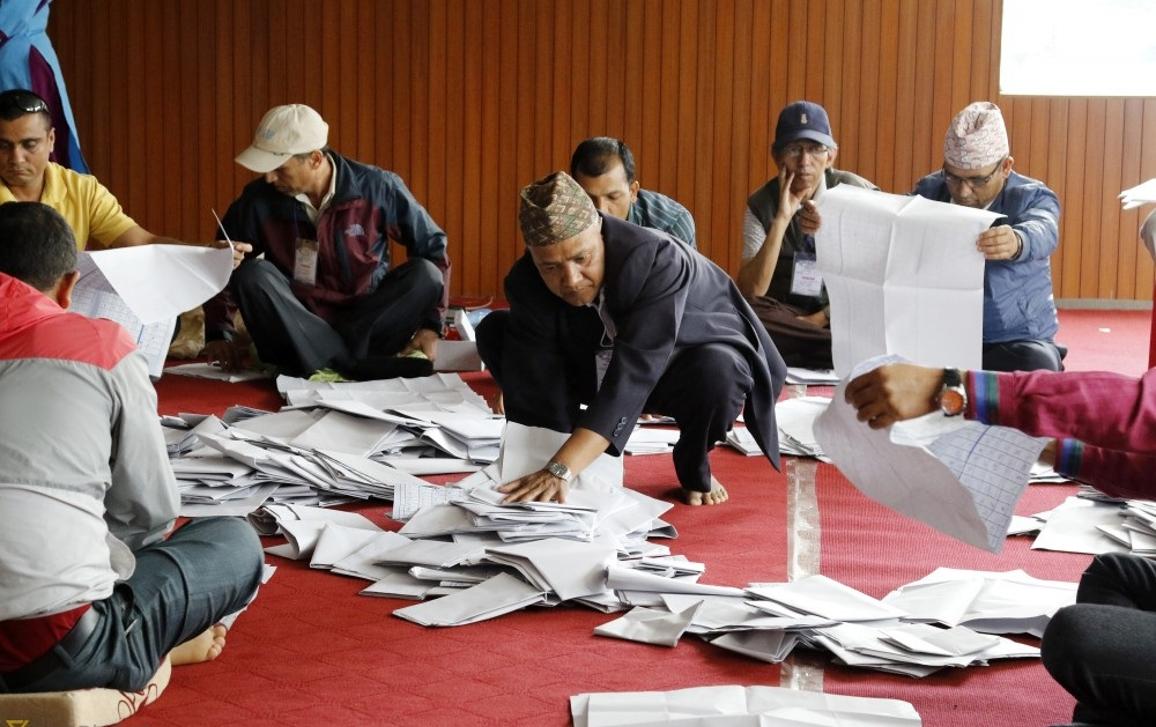 Staff of the polling station counting votes.