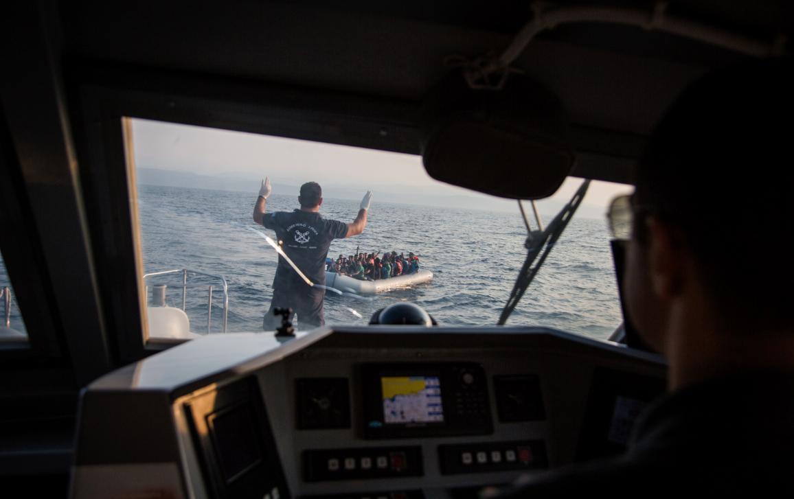  Greece's Hellenic Coast Guard approaches a boat containing 43 Syrian refugees in the Mediterranean sea, off the coast of Lesbos, Greece. 