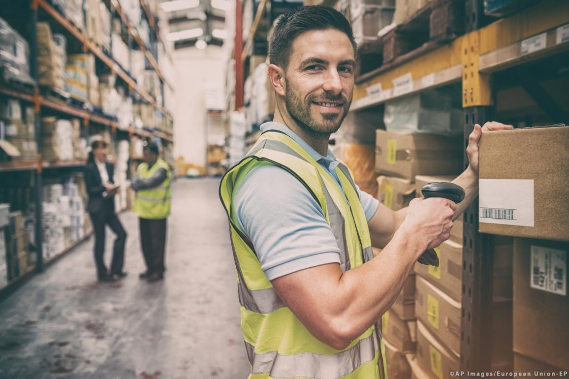 Warehouse worker scanning box ©AP Images/European Union-EP