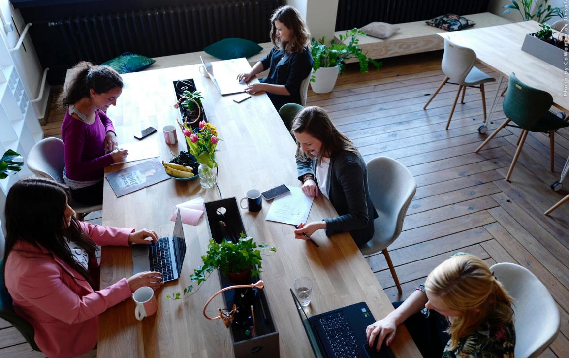 Young people are working in a coworking space. Photo by CoWomen on Unsplash