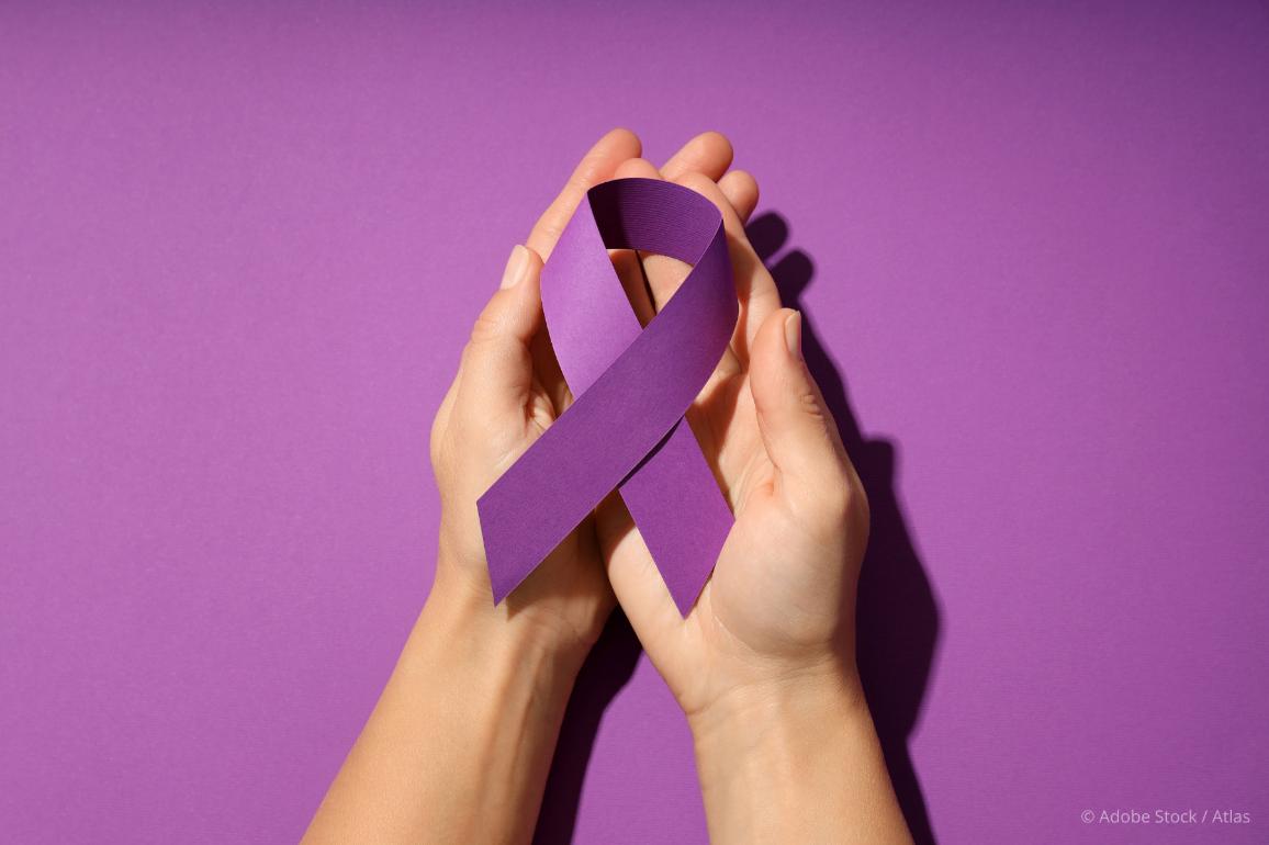 Violence against women purple ribbon in hands