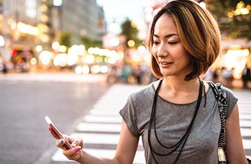 Business woman looking at mobile phone