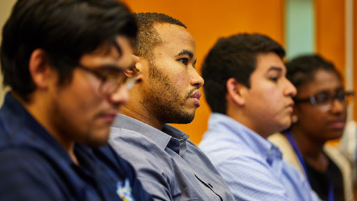 Trainees listen attentively to meeting