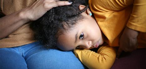 young girl with tummy ache