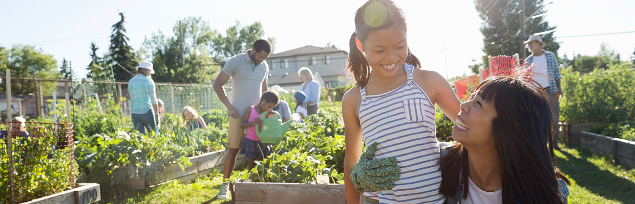 A mother and daughter are planting in a garden; image used for HSBC Singapore Structured Deposits