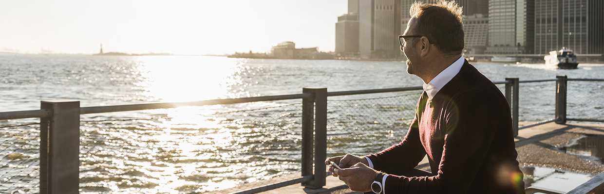 A man looking sea at seaside; image used for HSBC Singapore International financial support