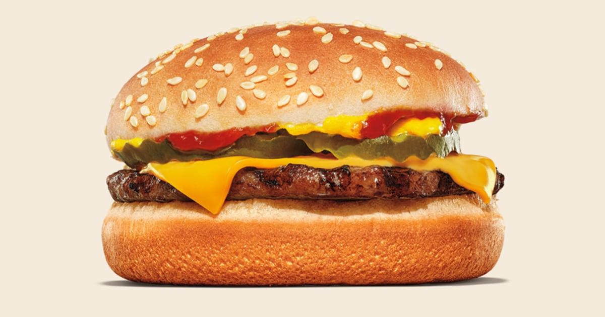 A cheeseburger with a sesame seed bun