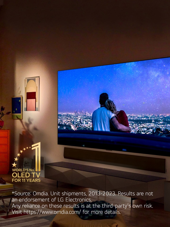 An image of LG OLED evo G3 on the wall of a modern and quirky New York City apartment with a romantic night scene playing on the screen.  11 Year World's No.1 OLED TV emblem. 