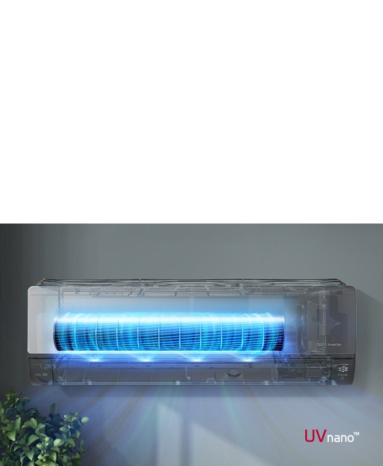 Wall-mounted LG Dual Inverter air conditioner with UVnano, glowing blue light for air purification, above a plant.