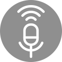 White microphone icon with sound waves above it on a grey background. White microphone icon with sound waves on a red background, symbolising audio or voice features.