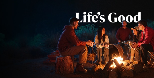 People enjoying camping with smiles, embracing the power of optimism.