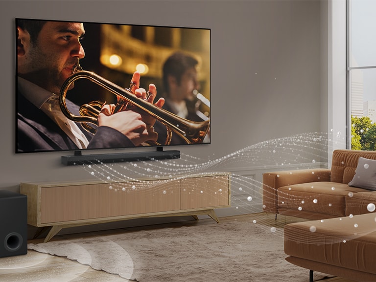 LG Soundbar zvučnik, LG TV i niskotonac u moderno uređenom gradskom stanu. LG Soundbar zvučnik emituje tri grane zvučnih talasa, napravljene od belih kapljica koje plutaju po podu. Pored Soundbar zvučnika je niskotonac koji stvara zvučni efekat odozdo. 