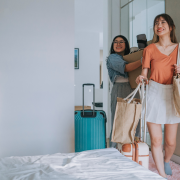 Two girls walking into a dorm room - back to school influencers for brands header