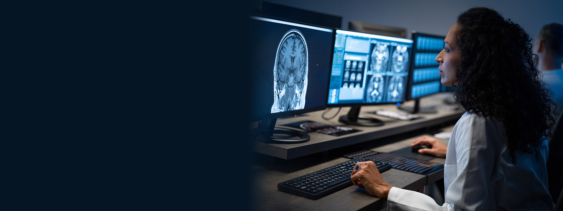 female radiologist analyzing an MRI image of the head