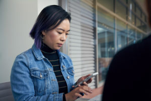 Woman reading message on her phone.