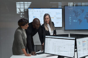 CISO (chief information security officer) collaborating with practitioners in a security operations center.