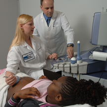 pregnant woman being examined by doctors