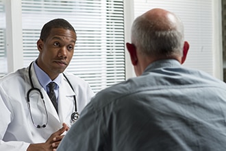 Man talking with his health care provider.