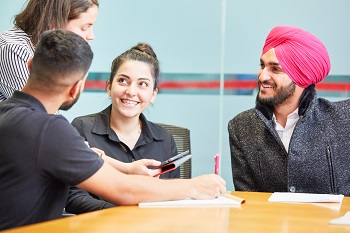 Interpreters sitting at a desk