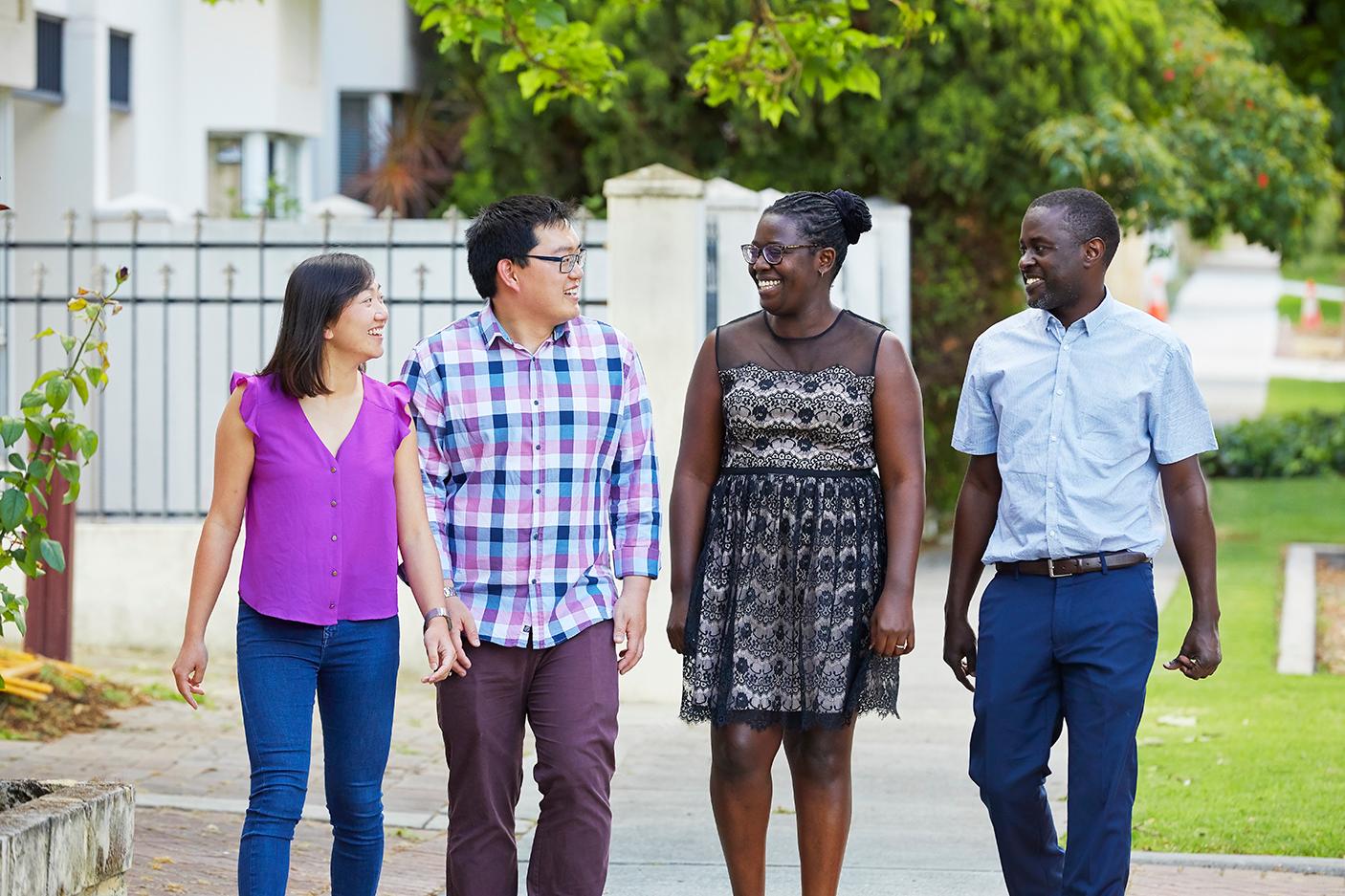 Two couples walking along a footpath 