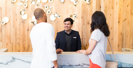 Omni Employee checks in guests