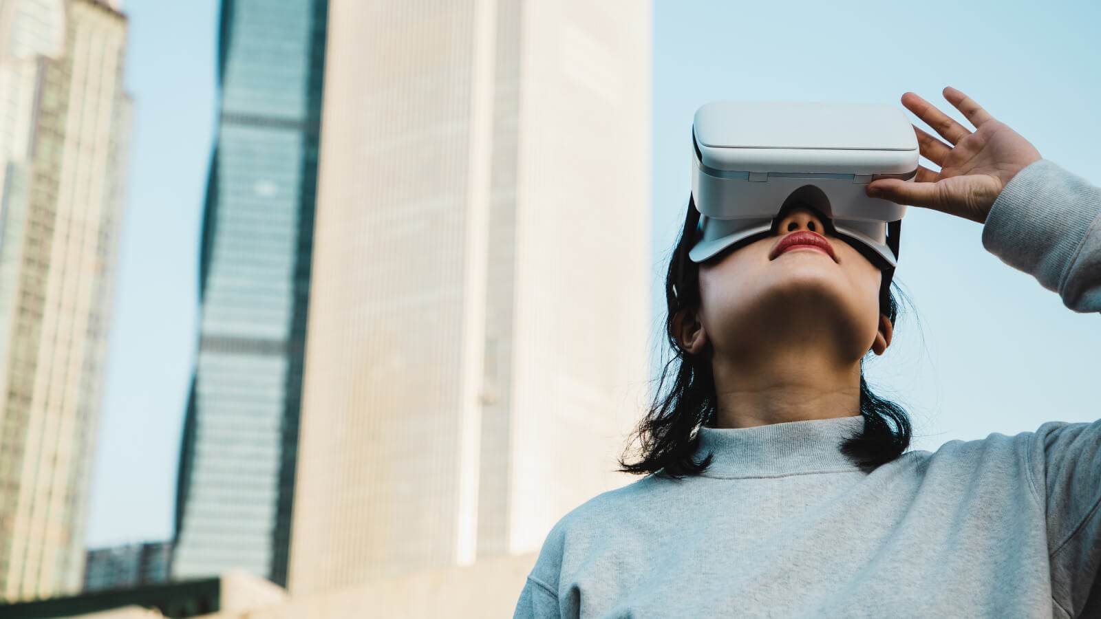 girl looking around with a VR headset